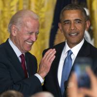 Vice President Joe Biden and President Barack Obama speak in June in the East Room of the White House in Washington. Obama is the man in the middle as his vice president weighs challenging his former secretary of state for the 2016 Democratic nomination. While Obama would officially stay neutral in a Biden-Clinton faceoff, the contest would essentially be a fight over which of his closest advisers is the rightful heir to his legacy. | AP