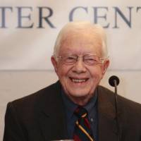Former U.S. President Jimmy Carter smiles as he talks to the media during a news conference in Kathmandu in this April 1, 2013, file photo. Carter said Wednesday that recent liver surgery revealed he had cancer that had spread to other parts of his body. Jimmy Carter, 90, says recent surgery found cancer in liver, elsewhere