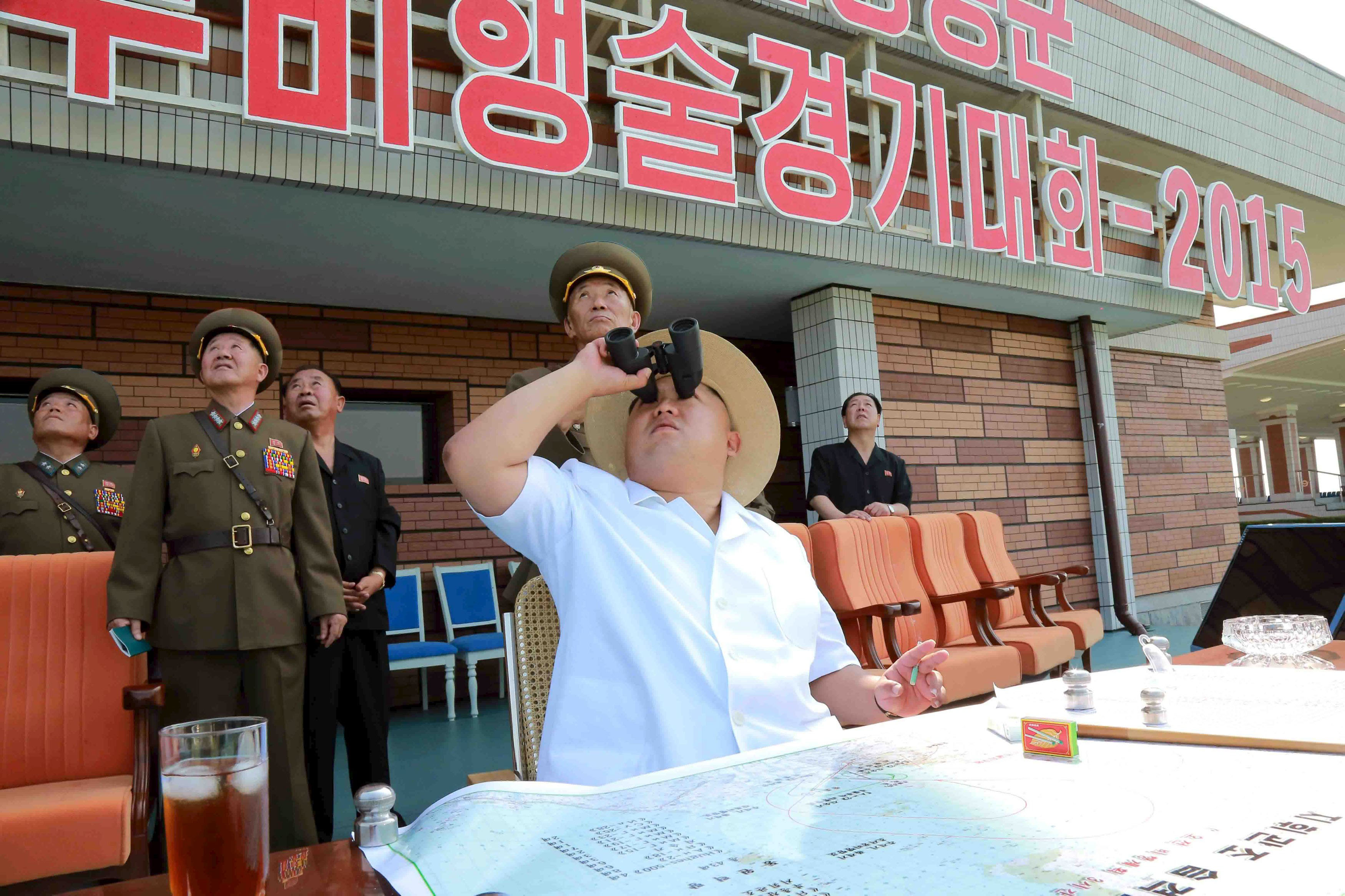 North Korean leader Kim Jong Un watches an aeronautics contest at Kalma Airport in Wonsan in this undated photo released Thursday. | REUTERS