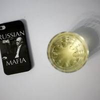 A mobile phone cover defiantly depicts Russian President Vladimir Putin as a gangster. | REUTERS