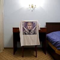 Russian President Vladimir Putin is illustrated on a T-shirt holding twin pistols. | REUTERS