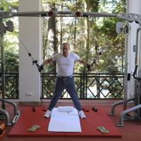 Russian President Vladimir Putin exercises in a gym at the Bocharov Ruchei state residence in Sochi, Russia, on Sunday. | REUTERS