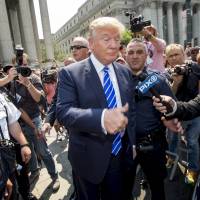 U.S. Republican presidential candidate Donald Trump departs the Manhattan Supreme Courthouse in New York on Monday. Trump reported for jury duty in New York on Monday in a black limo, signing an autograph and giving a fist-bump to a supporter as he took a break from the campaign trail. The real estate mogul\'s service came after a state judge in March fined him $250 for failing to respond to summonses to serve jury duty five times since 2006. | REUTERS