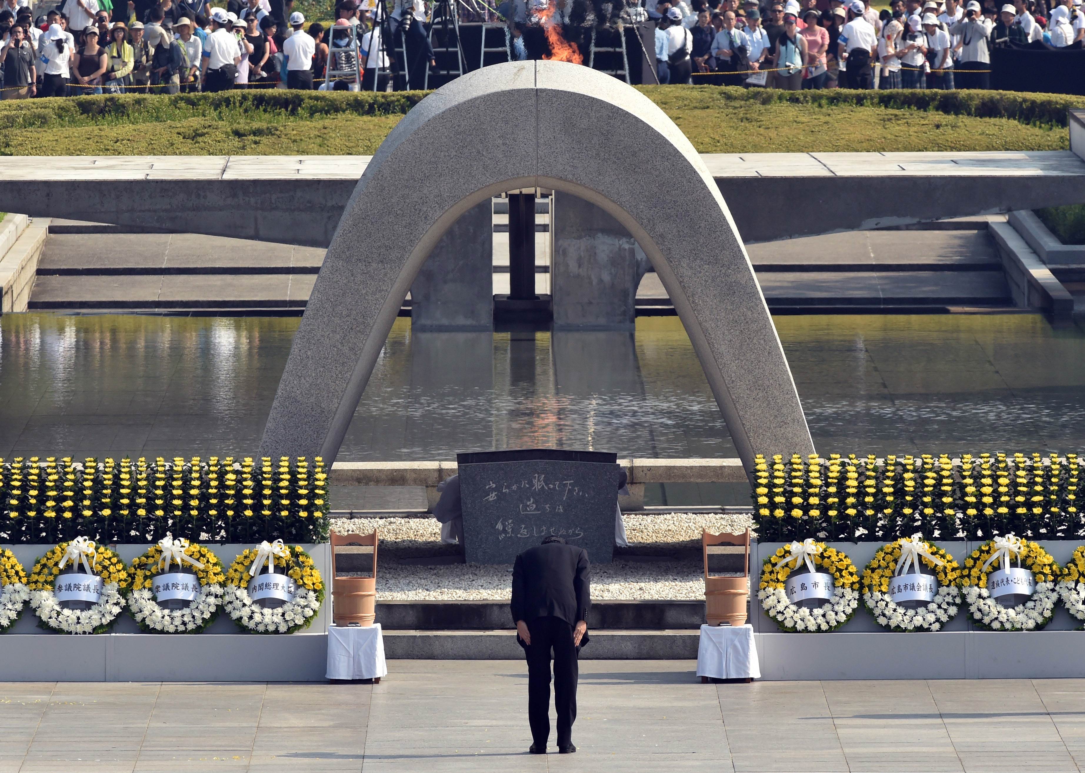 Prime Minister Shinzo Abe bows in front of the memorial cenotaph for victims of a 1945 atomic bombing during a memorial ceremony to mark the 70th anniversary at the Hiroshima Peace Memorial Park on Thursday.  | AFP-JIJI