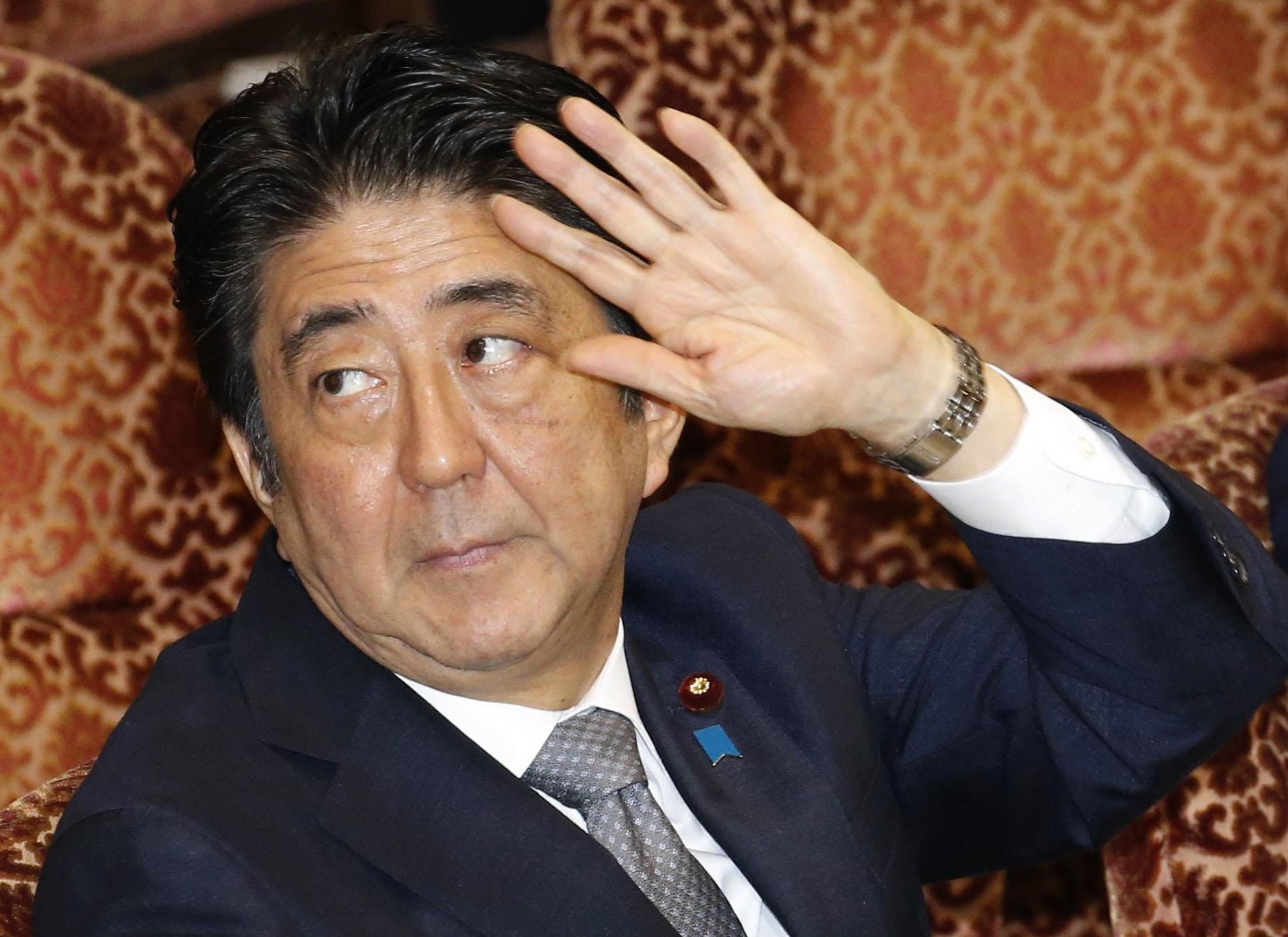 Prime Minister Shinzo Abe attends a budget committee session in the Upper House on Monday. | KYODO