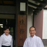 Akie Abe poses with a senior priest of Yasukuni Shrine in a photo posted on Facebook on Tuesday. | KYODO