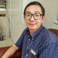 Michio Yoshida, the 57-year-old secretary-general of the Tokyo-based organization Orizuru no Ko, is interviewed in July in Tokyo\'s Shinjuku Ward. | TOMOHIRO OSAKI