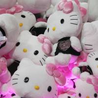 Hello Kitty soft toys are displayed at the Omotesando Hills in Tokyo. The iconic cat is joining a chorus of celebrity peace messages in the runup to Aug. 15. | BLOOMBERG