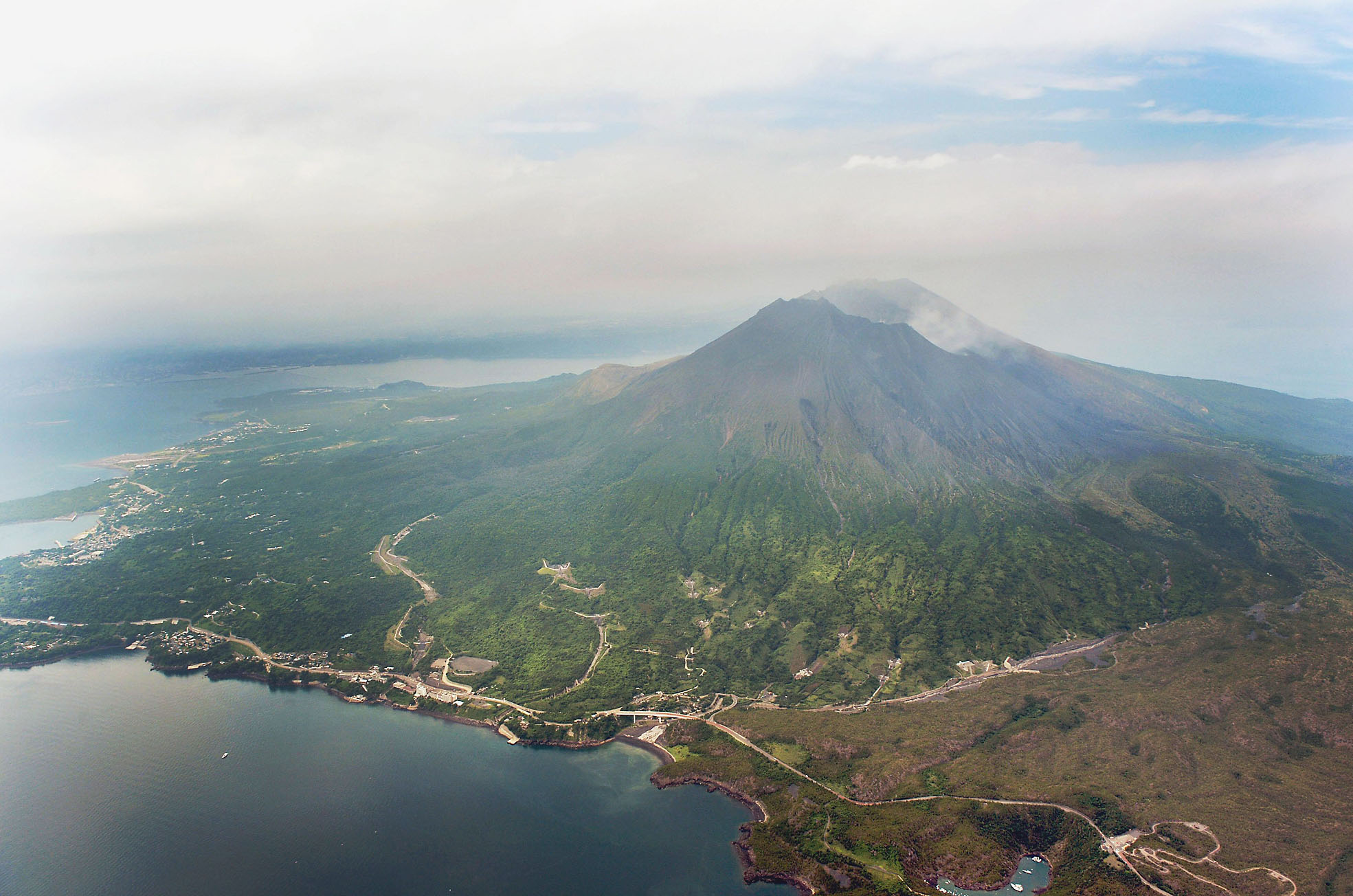Mount Sakurajima, across the bay from the city of Kagoshima in Kagoshima Prefecture, is seen Saturday. The same day, the Meteorological Agency raised the alert level to 4 and urged nearby residents to be prepared to evacuate as the volcano is showing signs of increased activity. | KYODO