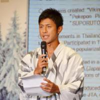Fuji Television Network announcer Daijiro Enami, who was appointed Japan\'s tourism ambassador to Thailand, makes a speech during the appointment ceremony in Bangkok on Saturday. | KYODO