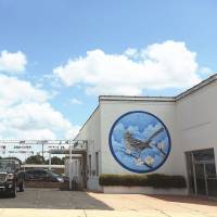 A wall-size “Mockingbird” mural is painted on the side of an automobile dealership in Monroeville. Exploring the traces of 'Mockingbird' in Alabama