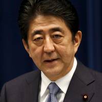 Under pressure: Prime Minister Shinzo Abe is seen delivering a statement on the anniversary of the end of World War II on Aug. 14. Abe’s misfortunes — from opposition to his defense guidelines to his health — have been the topic of heavy coverage in Japan’s weekly magazines this month. Abe catches heat from the weeklies in the dog days of summer