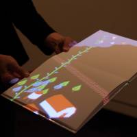 Open book: Books of blank pages are used as the canvas of Yusuke Shigeta’s light projected “Pixel Forest” (2011) Let the kids get their hands on art