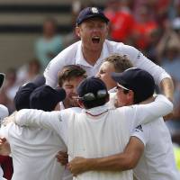 England’s players celebrate after defeating Australia in the fourth Ashes test at Trent Bridge in Nottingham, England on Saturday. England regains Ashes from Australia