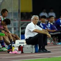 Japan manager Vahid Halilhodzic watches his team\'s 1-1 draw with South Korea at the East Asian Cup on Aug. 5 in Wuhan, China. | AFP-JIJI