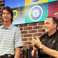 Hall of Fame pitcher Randy Johnson (left) and Arizona Diamondbacks president and CEO Derrick Hall visit MLB Cafe Tokyo on Thursday. | YOSHIAKI MIURA