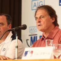 Arizona Diamondbacks chief baseball officer Tony La Russa (right) speaks as team president Derrick Hall listens during a Tokyo news conference on Tuesday. | KAZ NAGATSUKA