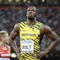 Usain Bolt of Jamaica prepares to compete in the men\'s 100-meter semifinals at the IAAF World Championships in Beijing on Sunday. | REUTERS