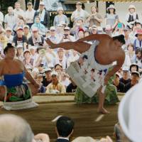 Yokozuna Harumafuji performs a dohyo-iri ring entering ceremony on Wednesday at Yahiko Shrine in the village of Yahiko, Niigata Prefecture. The performance is part of events to mark 100 years since the shrine was rebuilt after a fire. | KYODO