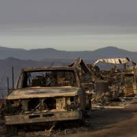 Burned property is seen near Clearlake, California, on Wednesday. The so-called Rocky Fire has burned across some 68,300 acres, destroying more than 50 buildings and displacing thousands of residents since flaring into life last week about 110 miles (177 km) north of San Francisco. | REUTERS