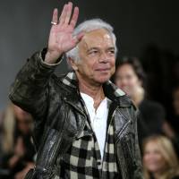 Ralph Lauren waves in 2008 at the conclusion of his Fall 2008 women’s fashion show during Fashion Week in New York. Lauren, creator of the Polo brand, will step aside as chief executive of his namesake company, the company announced Tuesday. Old Navy exec to replace founder at helm of Ralph Lauren