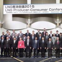 Attendees of the LNG Producer-Consumer Conference pose for a commemorative photo in Tokyo on Wednesday. Ministers and business delegates from around 50 countries and regions discussed the latest trends and challenges in the LNG market. | KYODO