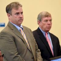 Attorney Gary McGillivray (left), representing Scott Leader, 38, and Attorney John Flanagan, representing Steve Leader, 30, appear before the judge to waive their clients\' hearing that could have determined whether they would be released on bail ahead of trial, in Dorchester, Massachusetts, Thursday. | REUTERS