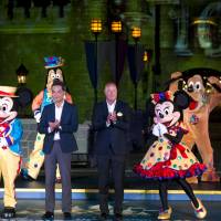 Hong Kong Chief Executive Leung Chun-ying (left) and Bob Chapek, chairman of Walt Disney Parks and Resorts, attend the 10th anniversary ceremony of Hong Kong Disneyland in the city Friday. | REUTERS