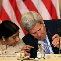 U.S. Secretary of State John Kerry chats with External Affairs Minister Sushma Swaraj at the U.S-India Strategic | REUTERS