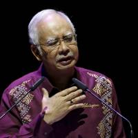 Malaysian Prime Minister Najib Razak addresses the country in a National Day message from Kuala Lumpur on Aug. 30. | REUTERS
