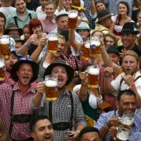 Visitors toast the opening of Oktoberfest in Munich last September. | REUTERS