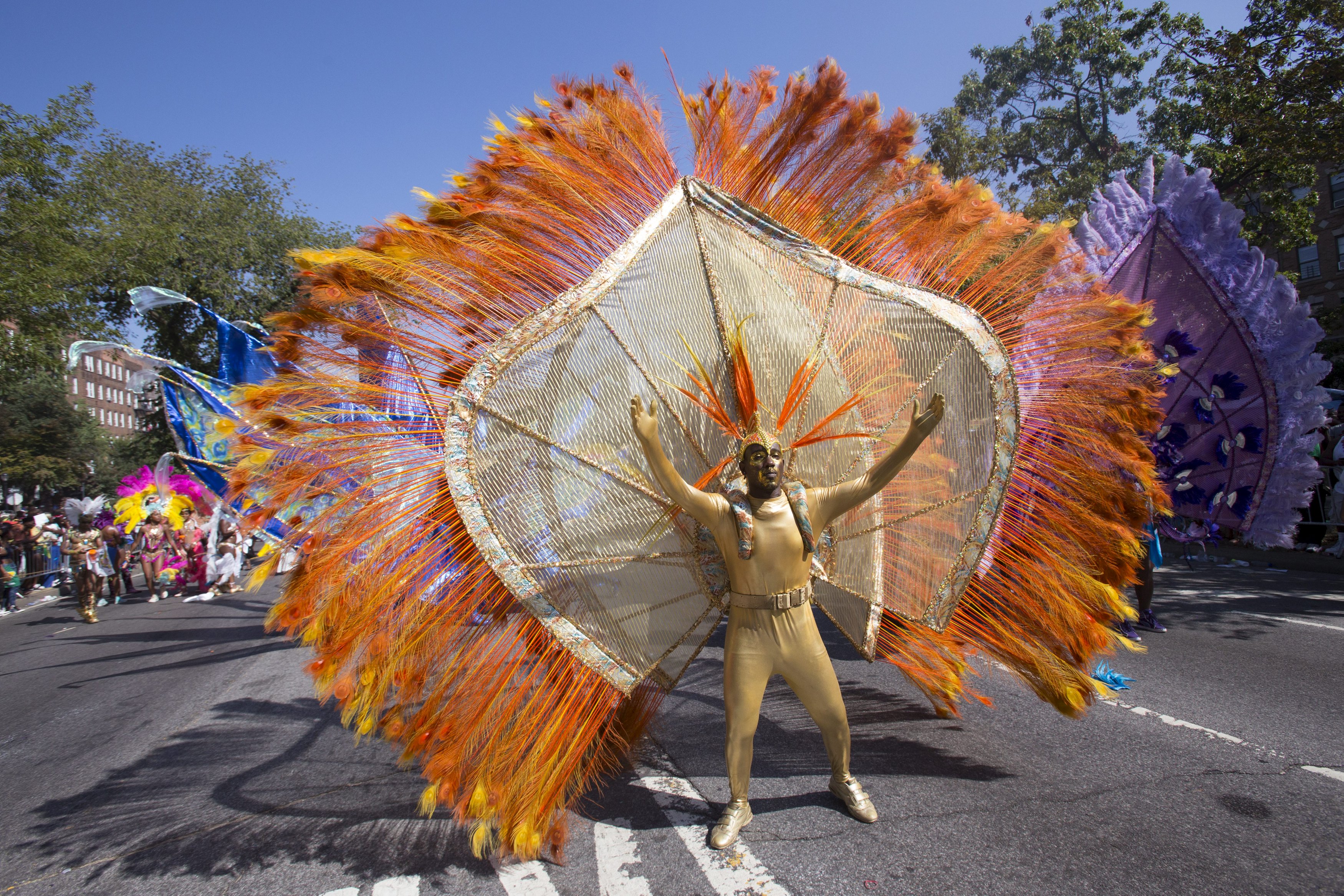 A Participant Dances During The West Indian Day Parade In Brooklyn New York A Participant Dances During The West Indian Day Parade In Brooklyn New York
