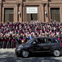 Pope Francis leaves St. Mathews Cathedral in his Fiat 500 after a midday prayer service in Washington, Wednesday, as bishops applaud. | AP