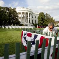 Workers prepare the South Lawn of the White House in Washington, Tuesday, the day before Pope Francis visits the White House. | AP