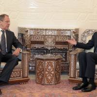 Syrian President Bashar Assad (right) meets with Russian Foreign Minister Sergey Lavrov in Damascus in February 2012. | AP