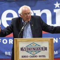 U.S. Democratic presidential candidate Sen. Bernie Sanders talks to tribal members of the Sac and Fox Tribe of the Mississippi in Iowa/Meskwaki Nation during a campaign event at the Meskwaki Nation Settlement near Tama, Iowa, on Friday. Sanders has opened a 9-point lead over fellow Democrat Hillary Rodham Clinton among party supporters in New Hampshire, according to an NBC News/Marist Poll on Sunday. | REUTERS