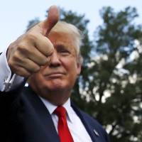 U.S. Republican presidential candidate Donald Trump gestures as he makes his way through the crowd after addressing a tea party rally against the Iran nuclear deal at the U.S. Capitol Wednesay. In a recent Rolling Stone article, he goes after rival Carly Fiorina\'s looks. | REUTERS