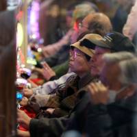 People play pachinko in the city of Osaka. As amore and more day-care centers for the elderly offer various forms of entertainment, Kobe has taken action against activities suggestive of gambling. | BLOOMBERG