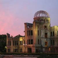 The Atomic Bomb Dome stands in twilight in the city of Hiroshima in July. | KYODO