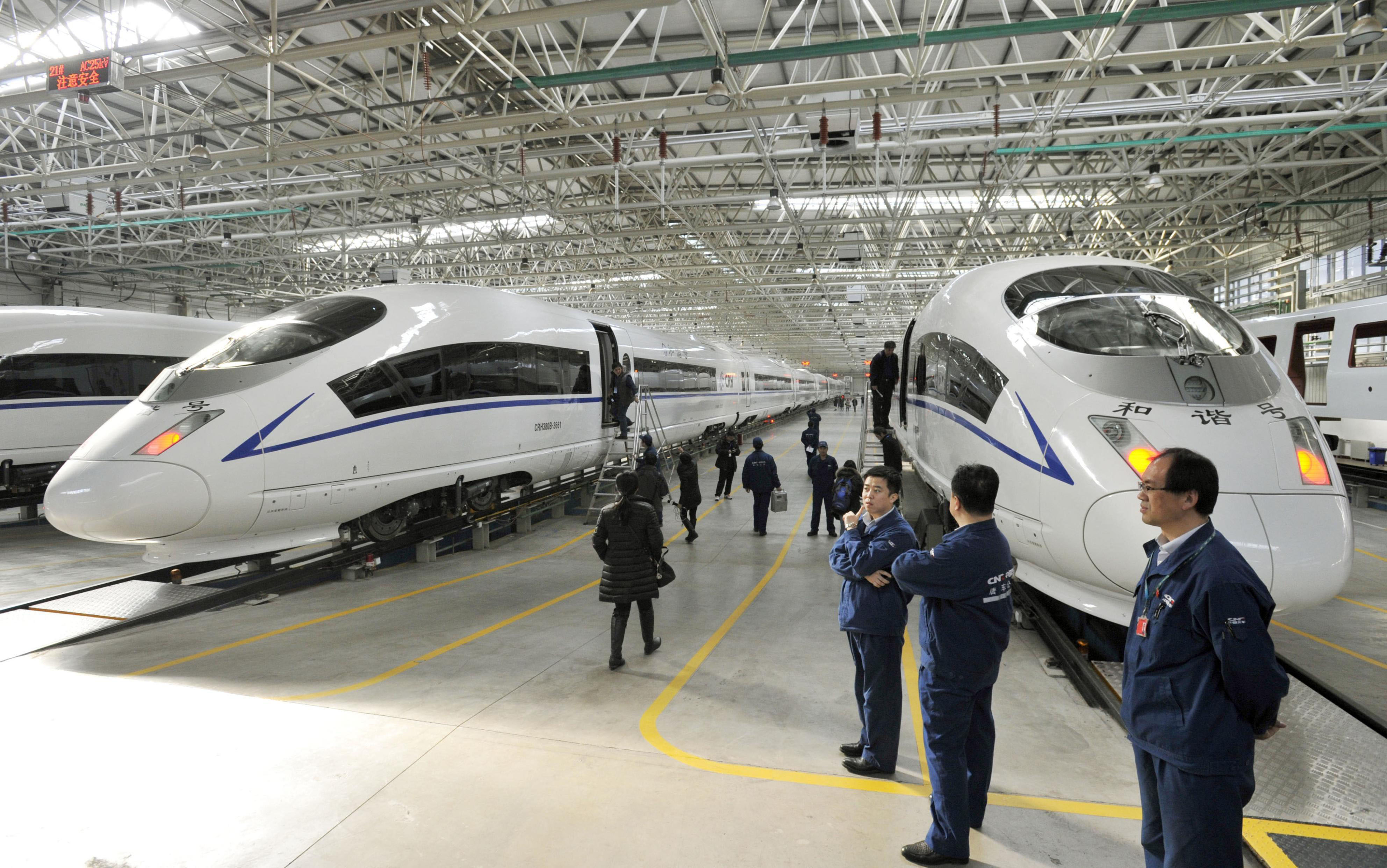 High-speed trains are assembled at a factory in China's Hebei province in February. | KYODO