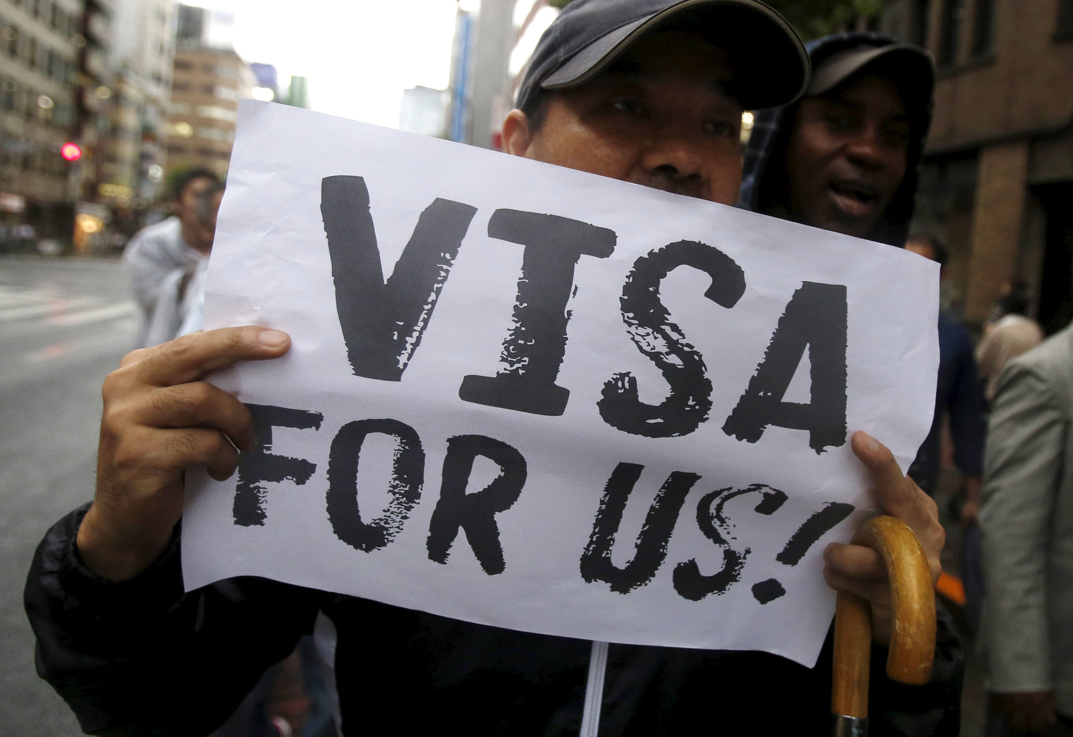 Protesters call on Japan to give asylum seekers visas, on Wednesday in central Tokyo. | REUTERS
