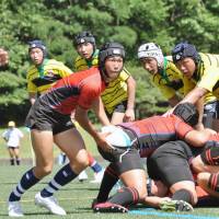 Members of rugby teams from high schools across Japan compete at the annual Gose rugby festival in Gose, Nara Prefecture, on July 21. | KYODO