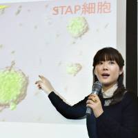 Haruko Obokata, then a researcher with the Riken research institute, announces the creation of so-called STAP cells in Kobe in this file photo taken in January 2014. | KYODO