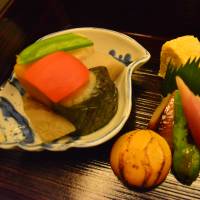 Flavorful: Kagaman offers up dishes of stone-roasted black cod, broiled chestnut, omelet and other treats as part of its multicourse lunch. | J.J. O\'DONOGHUE