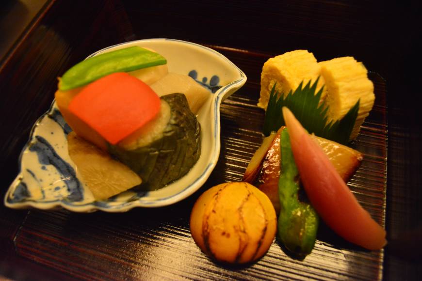 Kagaman Flavorful: Kagaman offers up dishes of stone-roasted black cod, broiled chestnut, omelet and other treats as part of its multicourse lunch. | J.J. O'DONOGHUE