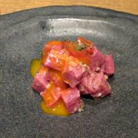 Wagyu mountain: Prime tenderloin is served in small cubes, dressed with egg yolk and only the lightest of seasonings.   | ROBBIE SWINNERTON