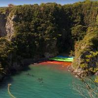 Fishermen with what appear to be pilot whales in a cove in Taiji, Wakayama Prefecture, on Sept. 10, 2009. | ROB GILHOOLY