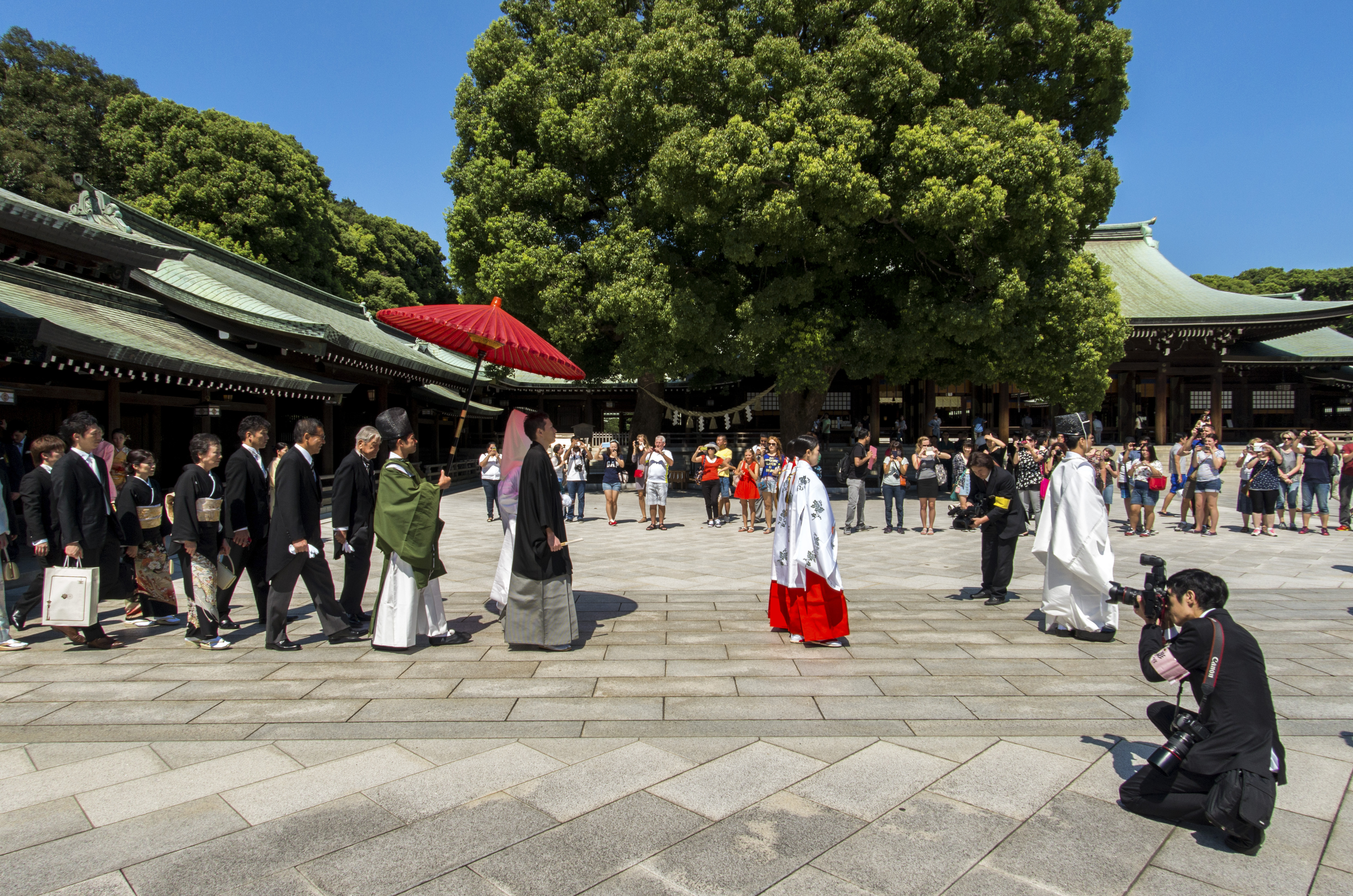 The big day: A wedding procession marches through a shrine, a more public affair than the nuptials of many celebrities. | ISTOCK