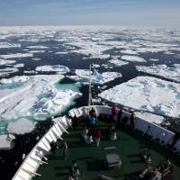 Northern exposure:  The 12,900-ton cruise ship MS Ocean Endeavour moves through ice off Baffin Island, in the Canadian territory of Nunavut, in July. | YOICHI YABE