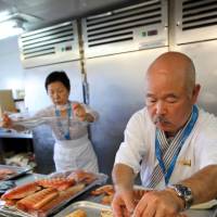 Chef Hidekazu Tojo prepares Arctic char aboard the ship. | YOICHI YABE